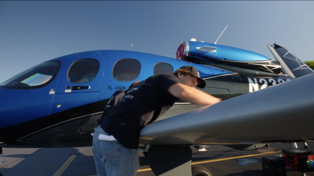 Blue private jet being detailed by a Cloud Nine Aviation technician at Morristown Municipal Airport