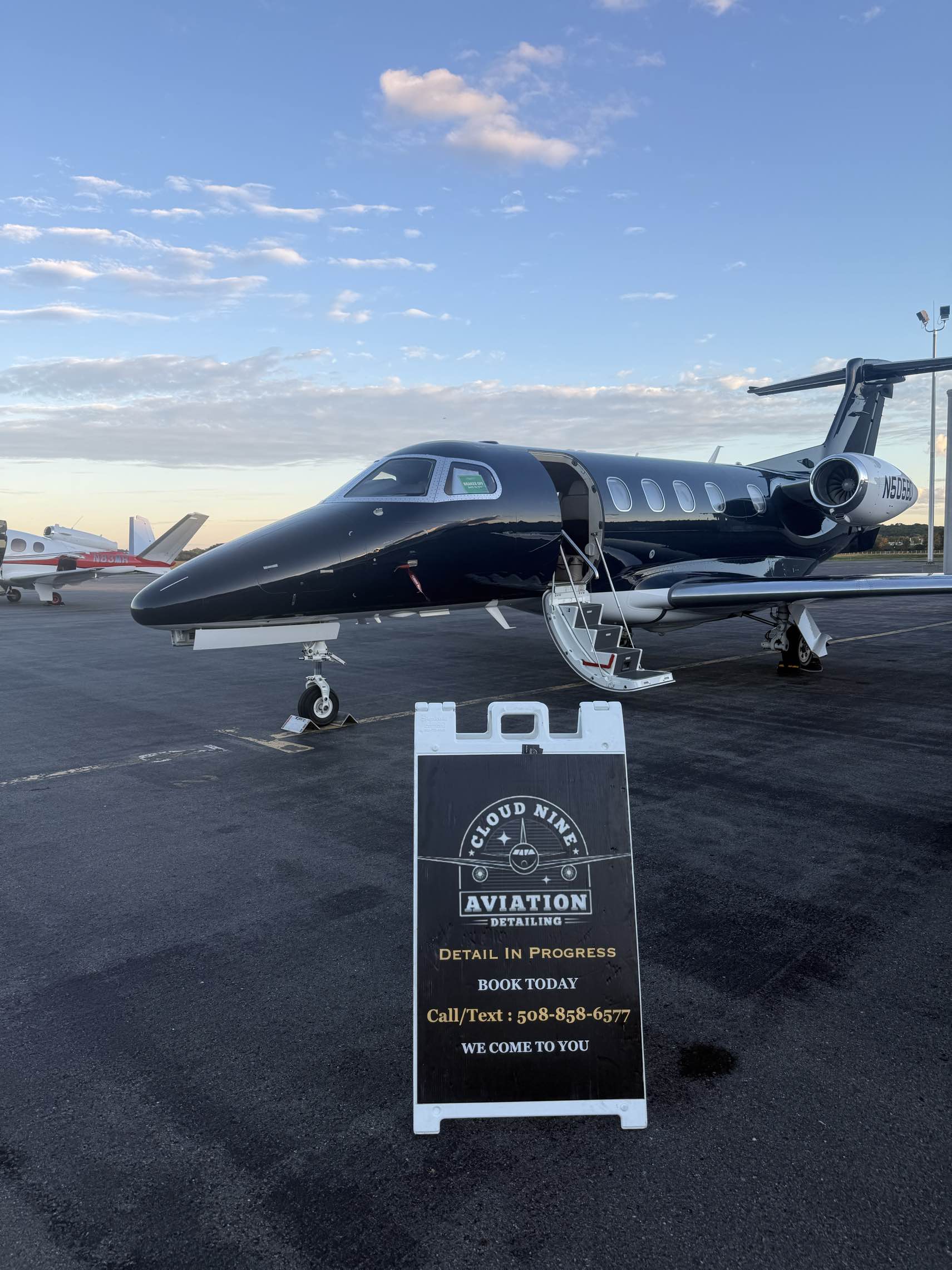 Private jet detailed at Martha's Vineyard Airport at dusk